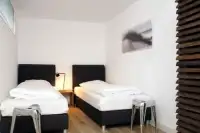 Moderne slaapkamer in 1 van de vakantiehuisjes